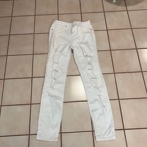 White ripped mid rise skinny jeans